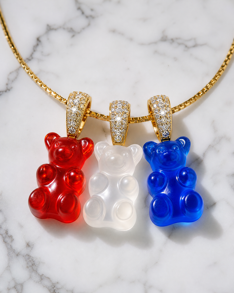 Red, white, and blue gummy bear necklace with three resin bear pendants on a gold chain