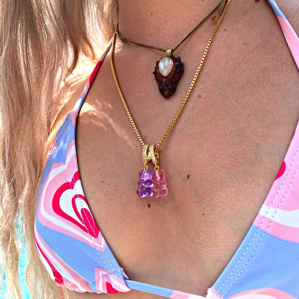 girl wearing purple & pink gummy bears on 18k gold chain - Gummy Bear Bling