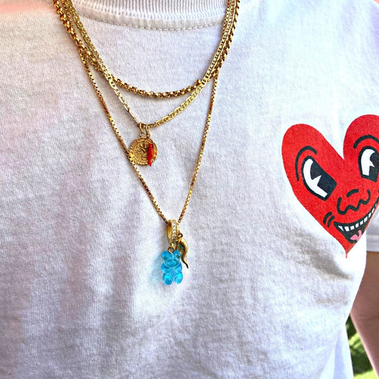 man wearing a blue gummy bear on 18k gold chain - Gummy Bear Bling